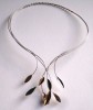 Silver and gold choker. Can be worn open or closed at the front